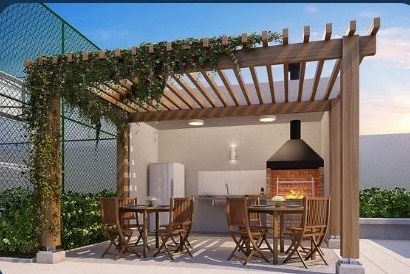 Área gourmet coberta com pergolado, churrasqueira e mesa — Vision Campestre
