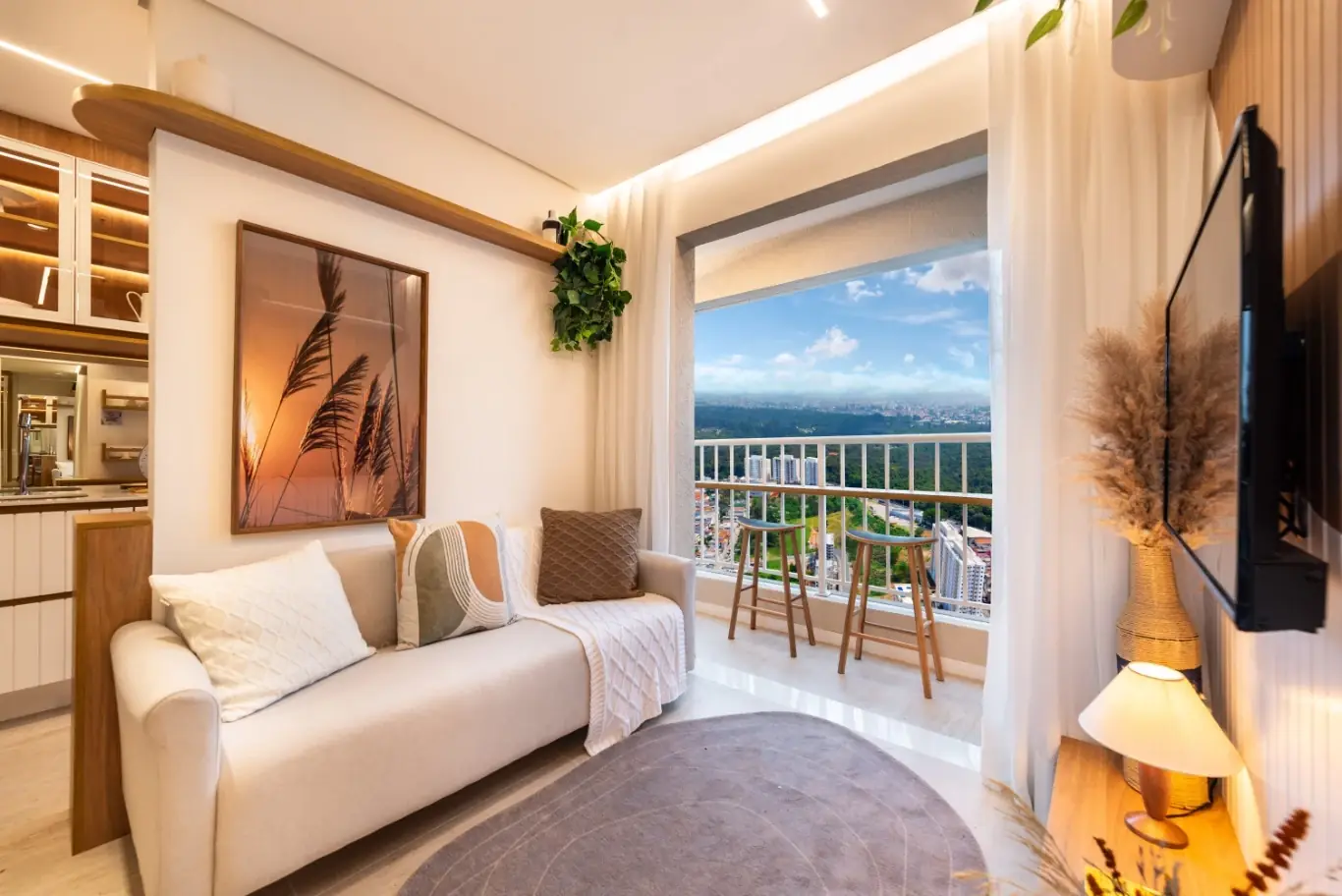 Ambiente decorado com sala de estar integrada à varanda — Manacá – Alto do Jardim